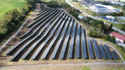 Aerial view of hillside solar panel arrays