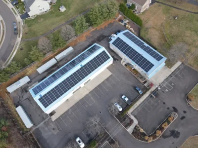 Aerial view of buildings with rooftop solar panels