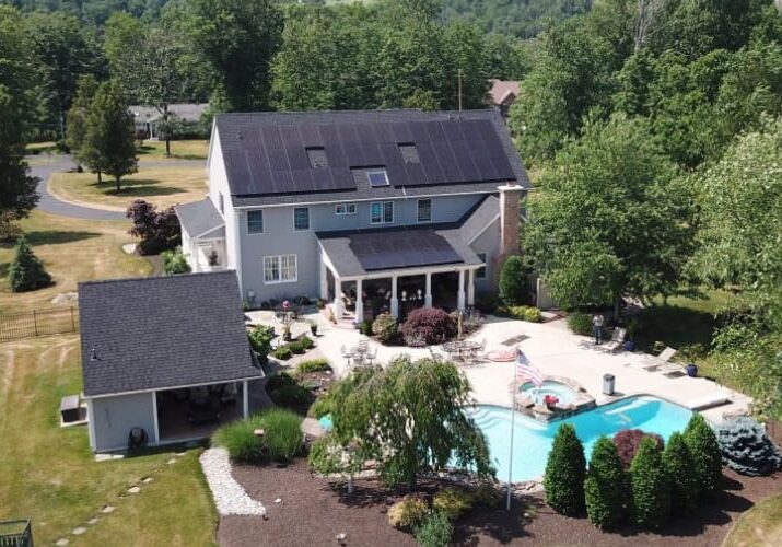 Moore Energy A large house with a pool and many trees